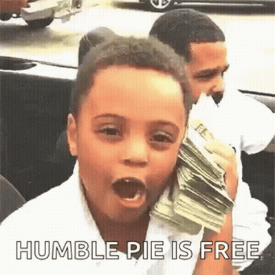 A Young Boy Is Holding A Stack Of Money In His Mouth While Sitting In A Car . GIF