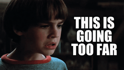 A Young Boy Is Looking At Something With The Words This Is Going Too Far Behind Him GIF
