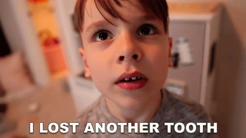 A Young Boy Is Looking At The Camera With The Words I Lost Another Tooth Behind Him GIF