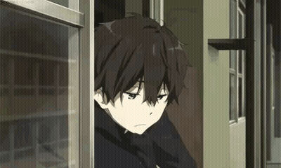 A Young Boy Is Looking Out Of A Window . GIF