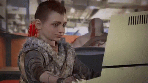 A Young Boy Is Playing A Video Game On A Computer In A Video Game . GIF