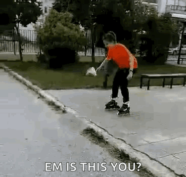 A Young Boy Is Rollerblading On A Sidewalk In A Park And A Person Is Asking Him If He Is This You . GIF