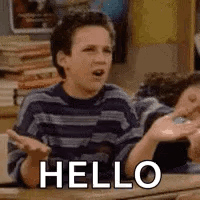 A Young Boy Is Sitting At A Desk With His Hands Outstretched And The Word Hello Written On His Face . GIF