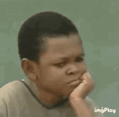 A Young Boy Is Sitting Down With A Sad Look On His Face . GIF