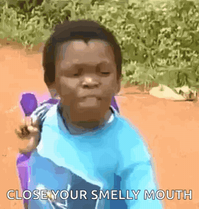 A Young Boy Is Sitting In A Chair And Making A Funny Face With The Words Close Your Smelly Mouth . GIF