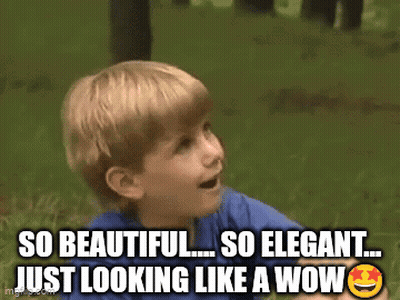 A Young Boy Is Sitting In The Grass With The Caption So Beautiful So Elegant Just Looking Like A Wow .. GIF