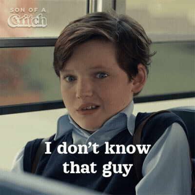 A Young Boy Is Sitting On A Bus And Says " I Don T Know That Guy " GIF