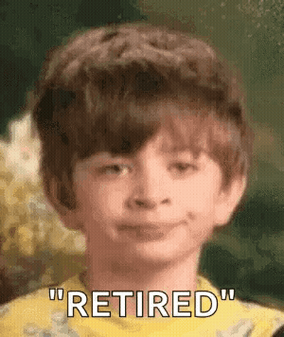 A Young Boy Is Smiling And Saying `` Retired '' In A Close Up Of His Face . GIF