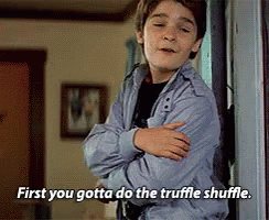 A Young Boy Is Standing In A Doorway With His Arms Crossed And Says First You Gotta Do The Truffle Shuffle . GIF