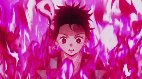 A Young Boy Is Surrounded By Red Flames In A Demon Slayer Anime . GIF