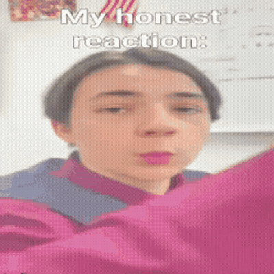 A Young Boy Is Wearing A Pink Shirt And Making A Funny Face With The Caption My Honest Reaction GIF