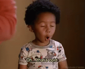 A Young Boy Is Yawning And Saying `` Oh ... That 'S Cold . '' GIF