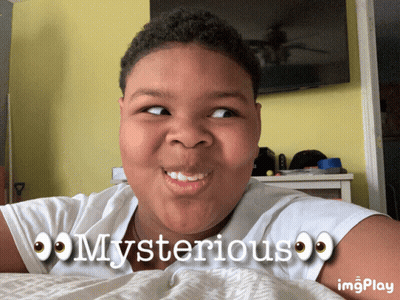 A Young Boy Laying On A Bed With The Words Mysterious On His Shirt GIF