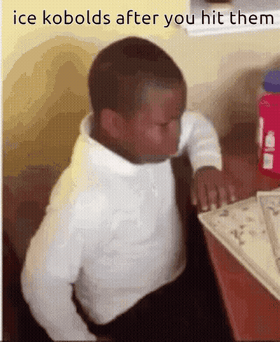 A Young Boy Sits At A Desk With The Words Ice Kobolds After You Hit Them On The Bottom GIF