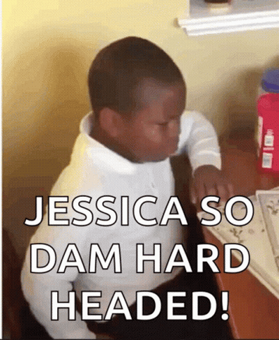 A Young Boy Sitting At A Desk With The Words Jessica So Dam Hard Headed Written Below Him GIF