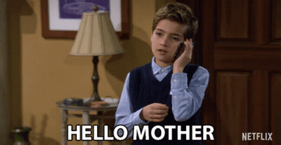 A Young Boy Talking On A Cell Phone With The Words Hello Mother Written On The Bottom GIF