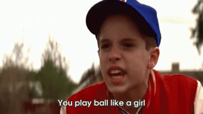A Young Boy Wearing A Baseball Cap And A Red Jacket Says " You Play Ball Like A Girl " GIF