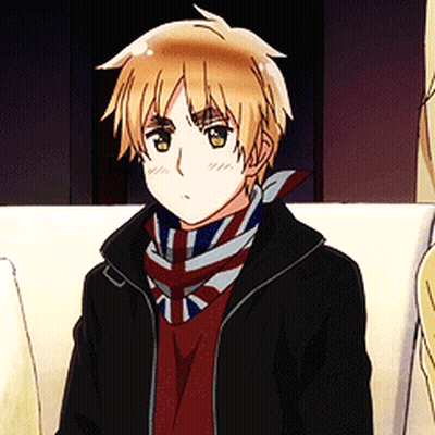 A Young Boy Wearing A Black Jacket And A Scarf With The British Flag On It GIF