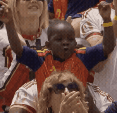 A Young Boy Wearing A Blue And Red Jersey With The Number 1 On It GIF