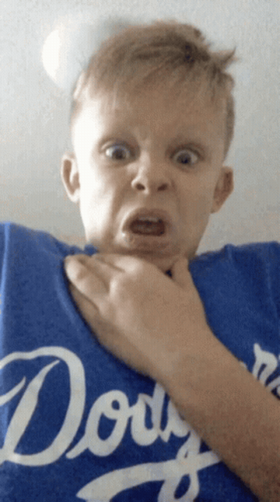 A Young Boy Wearing A Blue Dodgers Shirt Makes A Funny Face GIF
