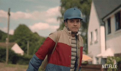 A Young Boy Wearing A Blue Helmet And A Netflix Logo GIF