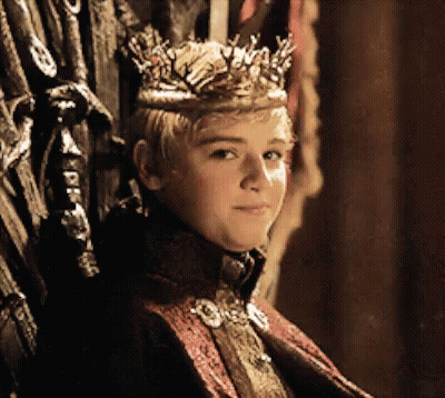 A Young Boy Wearing A Crown Sits On A Throne GIF