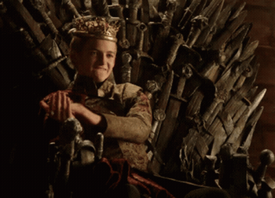 A Young Boy Wearing A Crown Sits On A Throne GIF