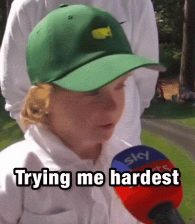 A Young Boy Wearing A Green Hat Is Talking Into A Microphone With The Words Trying Me Hardest Written Below Him GIF