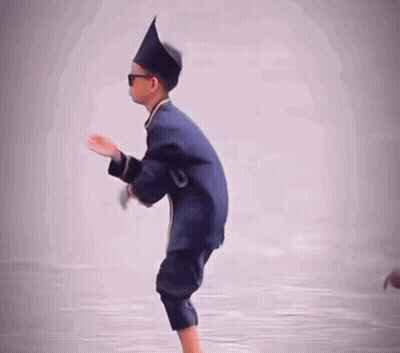 A Young Boy Wearing A Hat And Sunglasses Is Standing On One Leg GIF