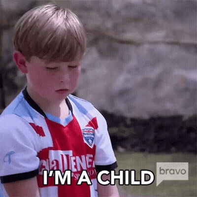 A Young Boy Wearing A Jersey That Says I 'M A Child GIF