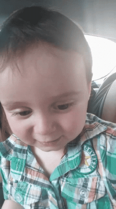 A Young Boy Wearing A Plaid Shirt Has A Patch On His Shirt That Says Cowboys GIF