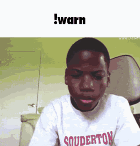 A Young Boy Wearing A Shirt That Says Souderton Is Making A Funny Face GIF