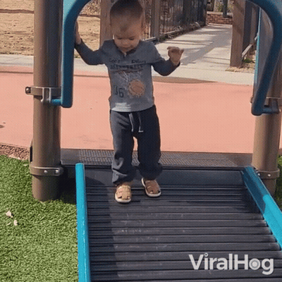 A Young Boy Wearing A Shirt With The Number 46 On It Is Walking Down A Roller Coaster GIF