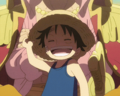 A Young Boy Wearing A Straw Hat And A Blue Tank Top Smiles With His Eyes Closed GIF