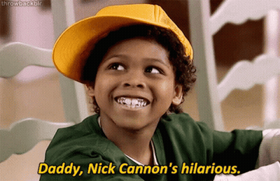 A Young Boy Wearing A Yellow Hat Says Daddy Nick Cannon 'S Hilarious .. GIF