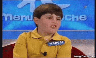 A Young Boy Wearing A Yellow Shirt With The Name Manuel On It GIF