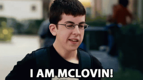 A Young Boy Wearing Glasses And A Black Shirt Says I Am Mclovin GIF