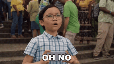 A Young Boy Wearing Glasses Is Holding A Cell Phone And Says Oh No GIF