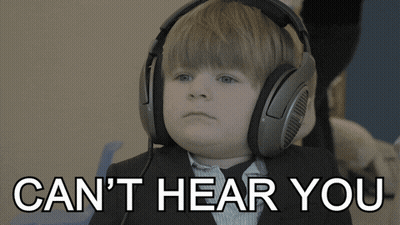 A Young Boy Wearing Headphones With The Words " Can 'T Hear You " Below Him GIF