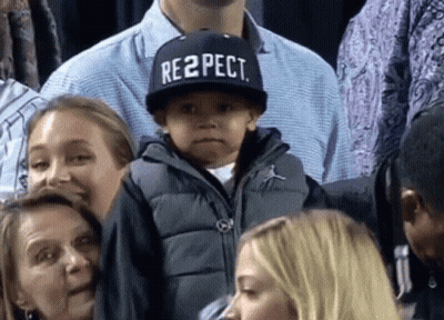 A Young Boy Wears A Hat That Says Respect GIF