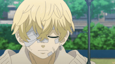 A Young Boy With A Bandage On His Eye Is Looking Down GIF