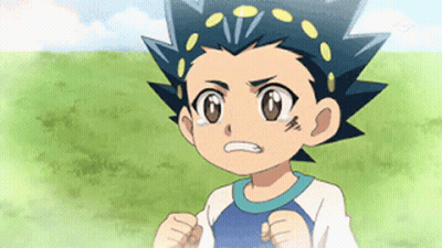 A Young Boy With A Blue Shirt On Is Standing In A Grassy Field . GIF