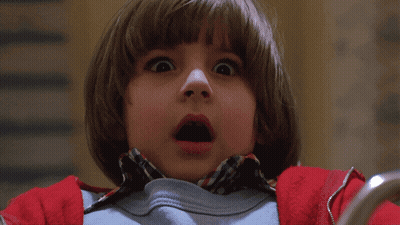 A Young Boy With A Surprised Expression On His Face GIF