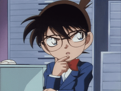 A Young Boy With Glasses And A Red Bow Tie Is Thinking GIF