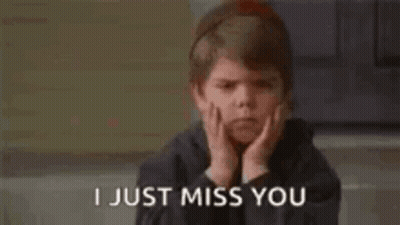 A Young Boy With His Hands On His Face And The Words `` I Just Miss You '' . GIF