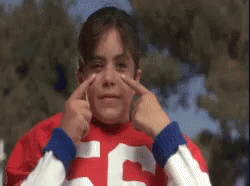 A Young Girl In A Red And White Jersey With The Number 55 On It GIF