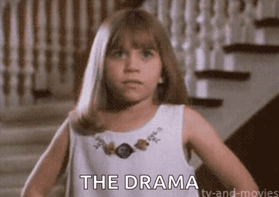 A Young Girl In A White Dress Is Standing In Front Of Stairs And Says The Drama . GIF