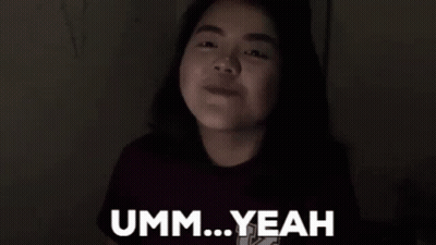 a young girl is making a funny face with her eyes closed and says umm ... yeah .