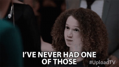 A Young Girl With Curly Hair Is Saying I 'Ve Never Had One Of Those GIF