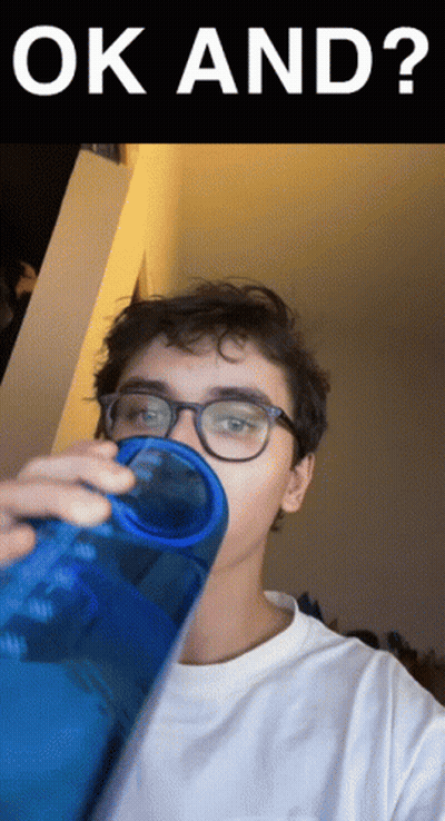 A Young Man Drinking From A Blue Bottle With The Words Ok And Written Above Him GIF